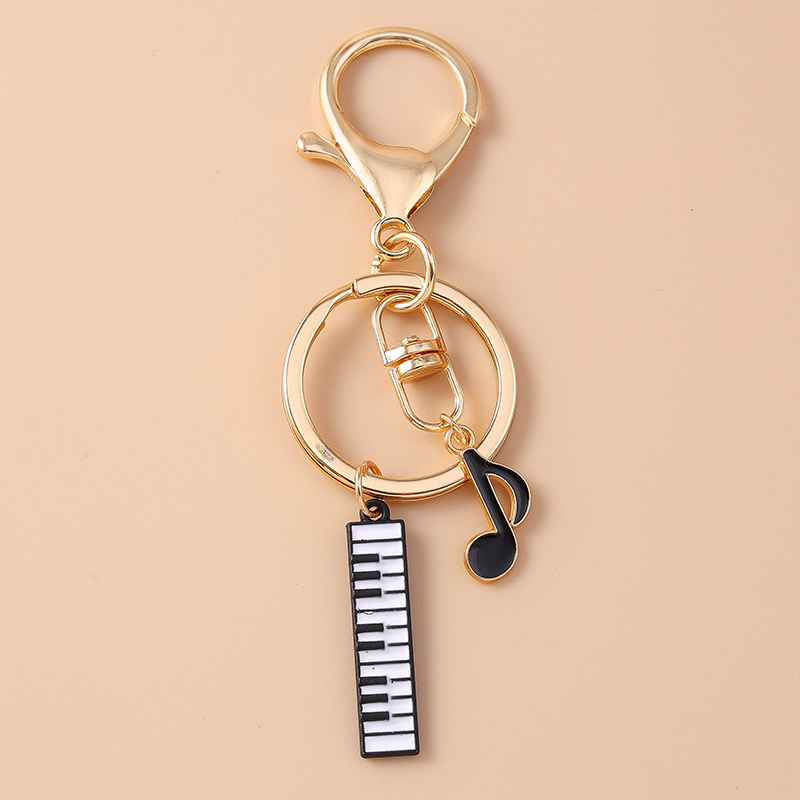 Cute Enamel Mini Piano Keychai – Musical Instrument Tabla Bewertung und Preis