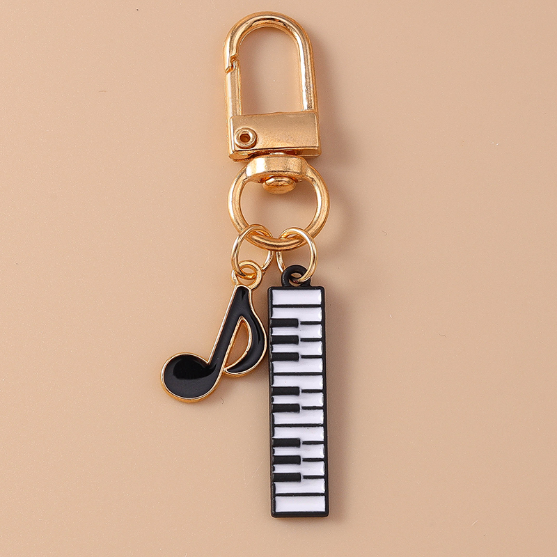 Cute Enamel Mini Piano Keychai – Musical Instrument Tabla Bewertung und Preis